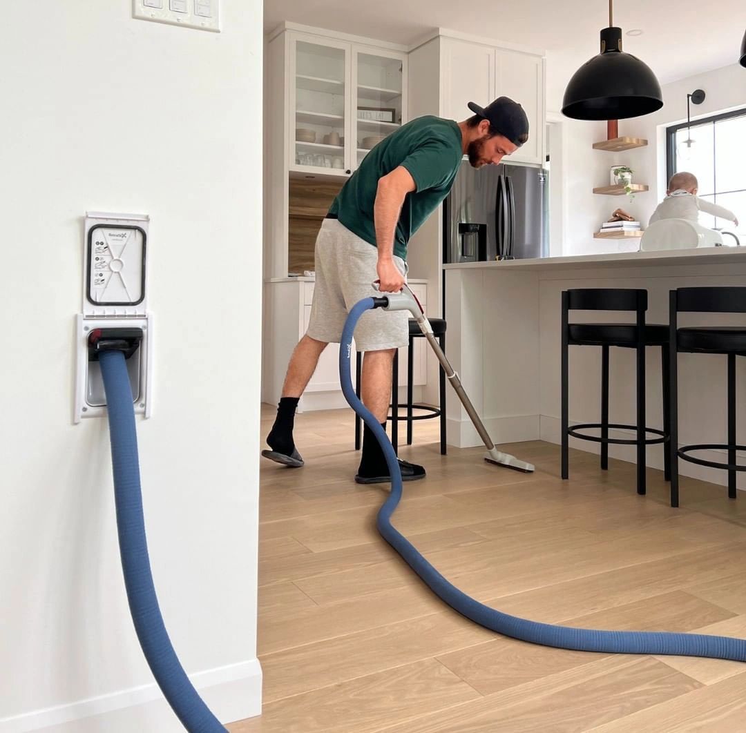 man-vacuuming-at-home
