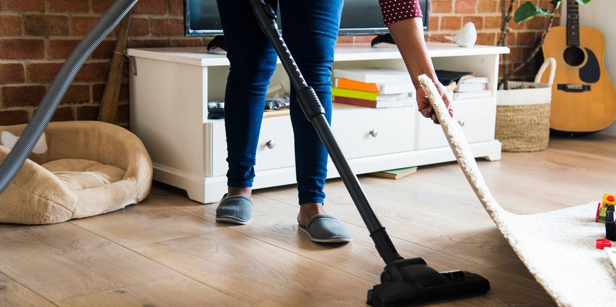 vacuuming-under-rug